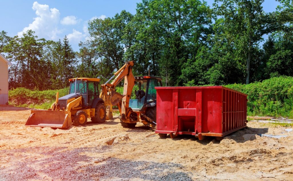 Yellow Excavator at Construction new tractor excavators and garbage containers